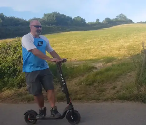 elka model t pro electric scooter being ridden