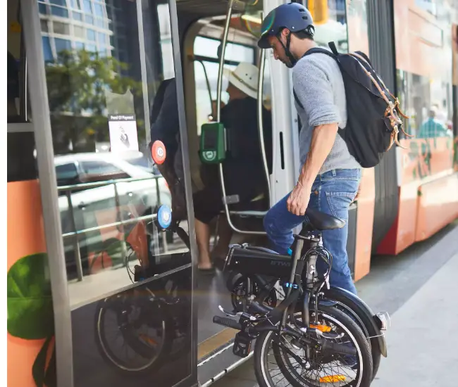 Best Electric Bikes for Delivery - Earn More in 2023 19 btwin tilt folded and being carried on a train