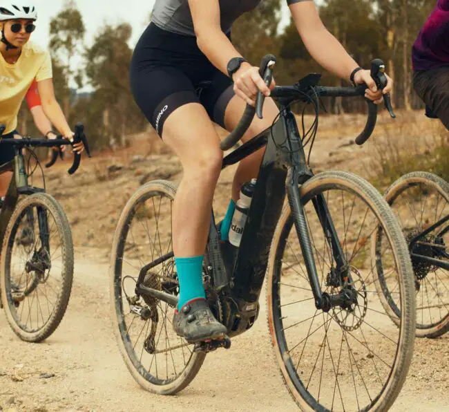 the new cannondale topstone neo gravel e-bike being ridden off road