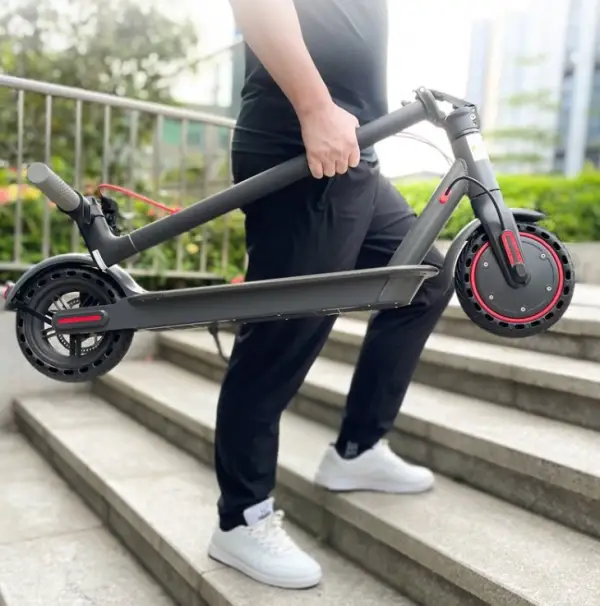 Aovo Pro ES80 Electric Scooter 4 aovo pro es80 being carried